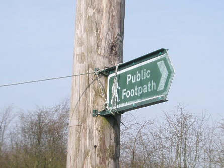 A footpath signpost intended to provide information and guidance